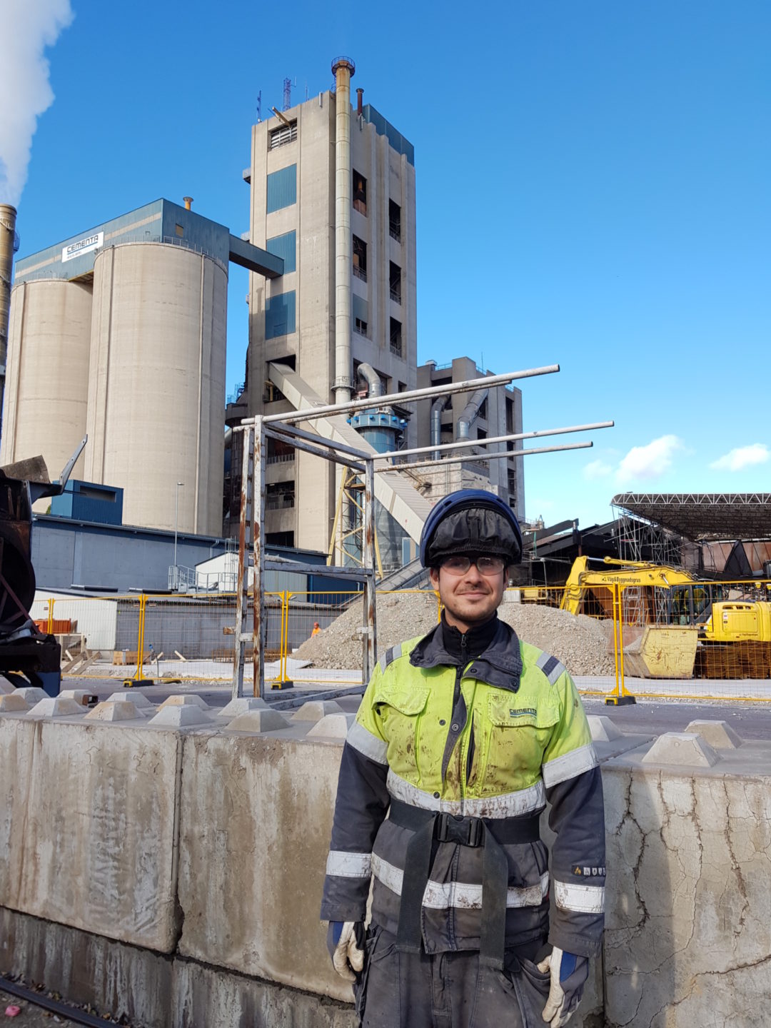 Christian Roman posing in front of the Cementa factory